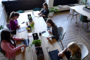 group of people working in an office desk