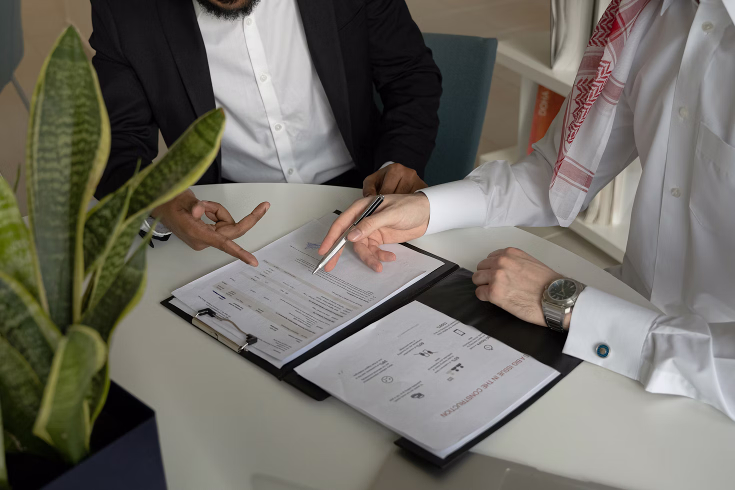 people signing papers